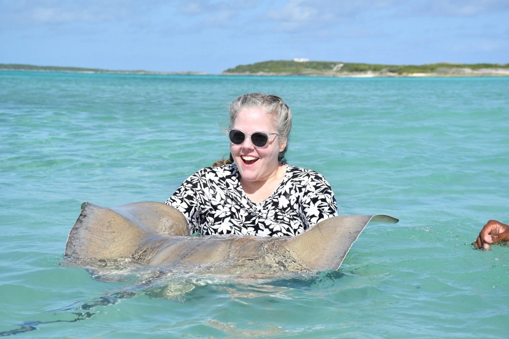 woman swimming with a sting ray