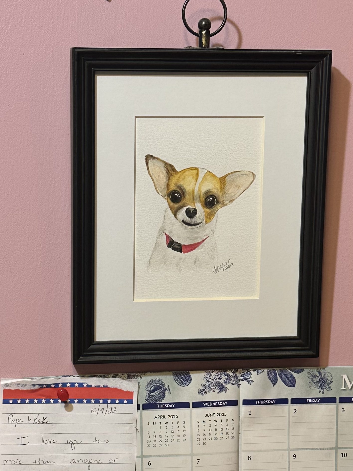 wall with a painting of a small dog